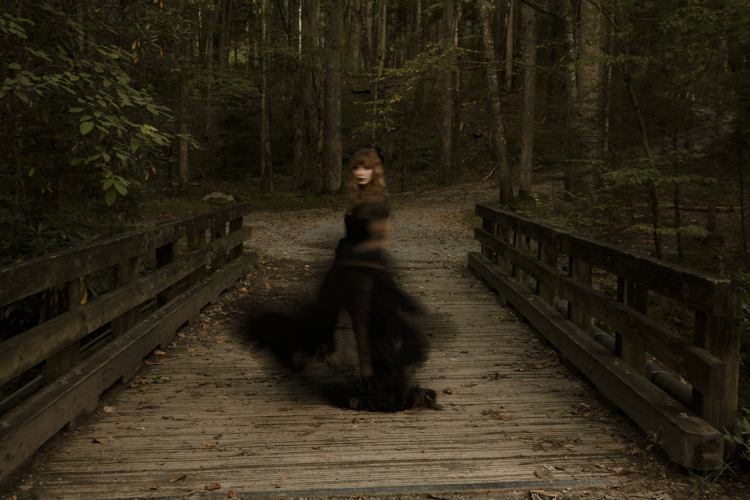 woman twirling in a dark robe