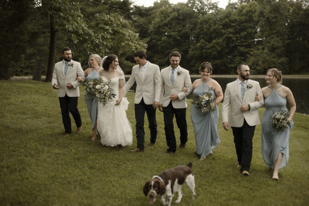 Callie and Matt walk  with their bridal party