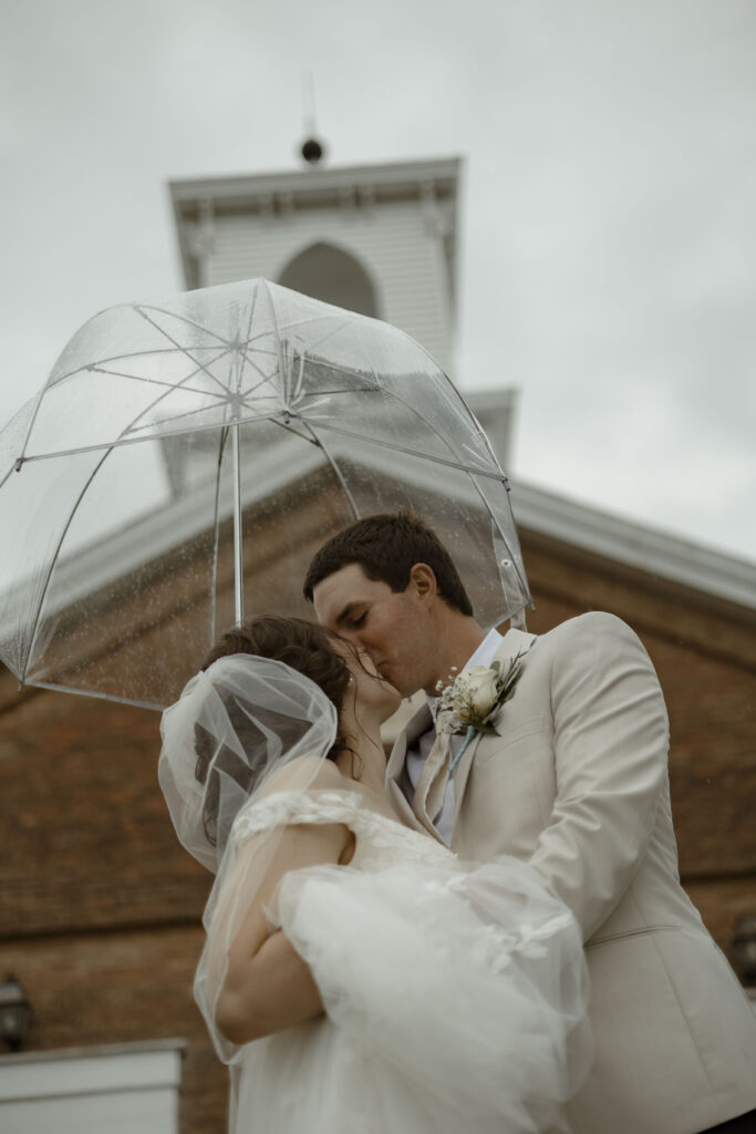 Callie and Matt share a kiss under an umbrella outside the church