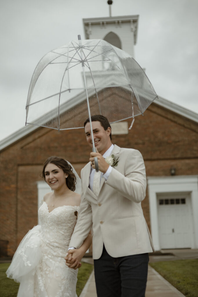 Callie and Matt smile at the camera outside the church