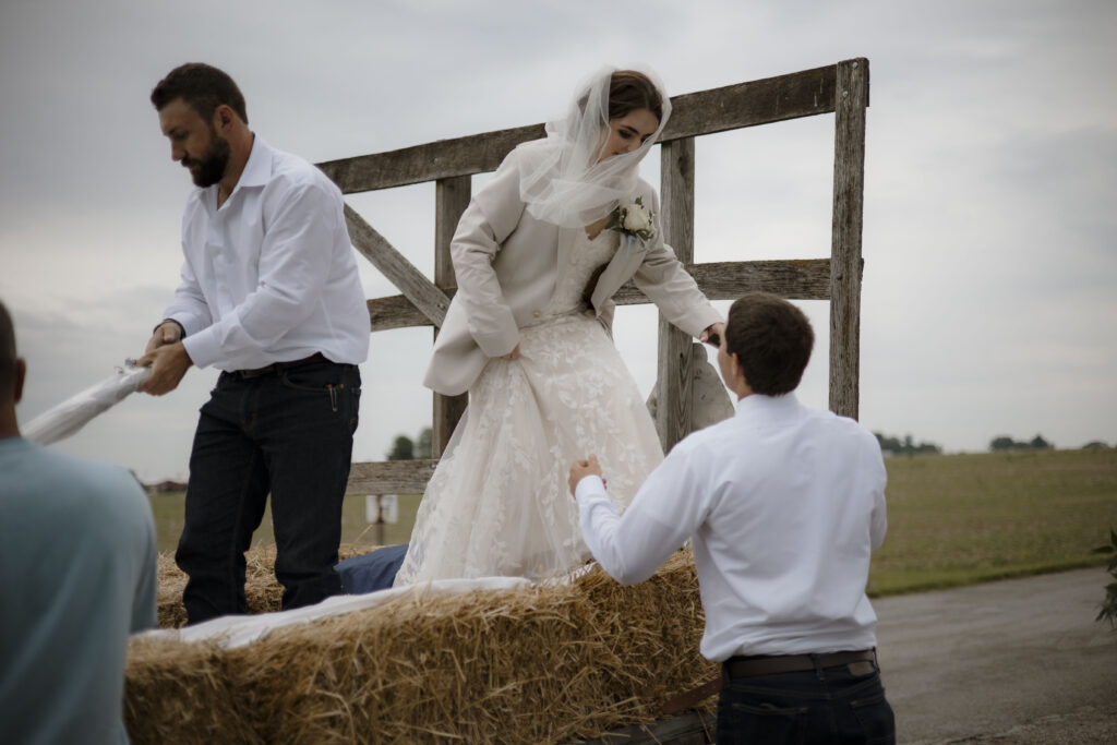 Callie gets a hand from Matt getting out of the wagon