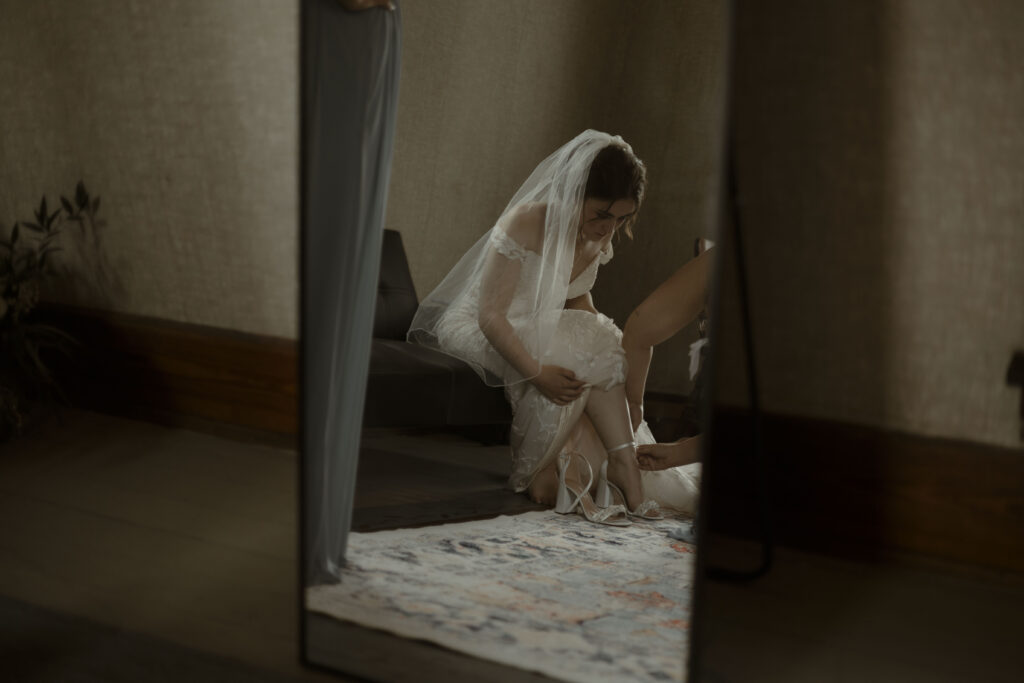 Callie gets help putting on her shoes 