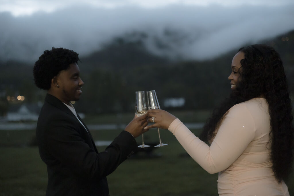 Chris and Kiki drink to their combined future